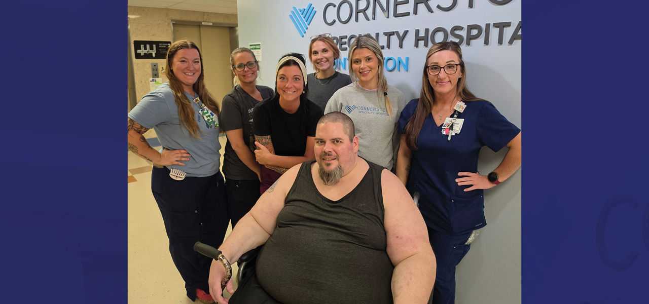 Cornerstone Specialty Hospital Huntington patient David poses with his care team. 