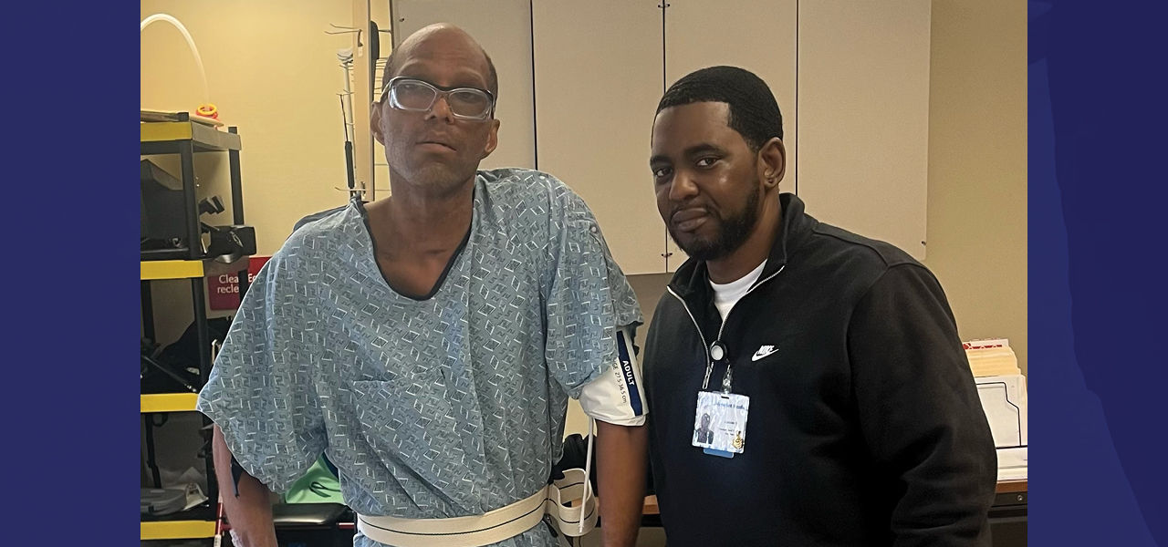 Cornerstone Specialty Hospital Little Rock patient Demetrias stands and poses with his care personnel